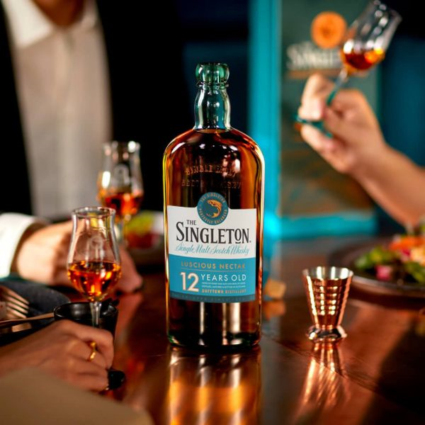 Bottle of The Singleton 12 Years Old Single Malt Scotch Whisky on a wooden bar counter at El Baron Saigon Lounge